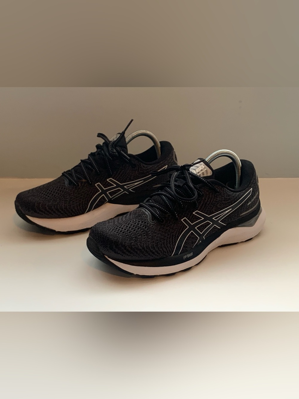 Asics Gel-Cumulus 24 running shoes in a black and silver